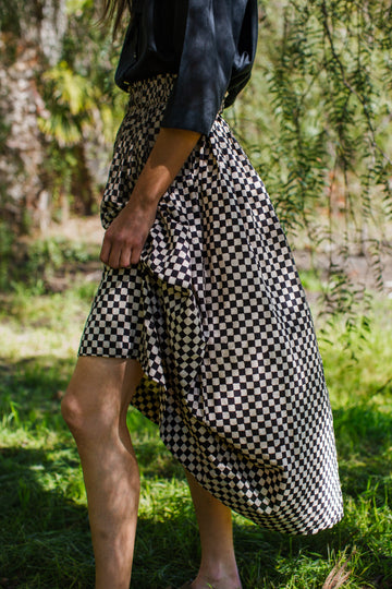 Checkered block printed, black and white skirt, ankle length, this skirt is made in collaboration between Erica Kim and World of Crow, smocked elasticated waist, sustainably made