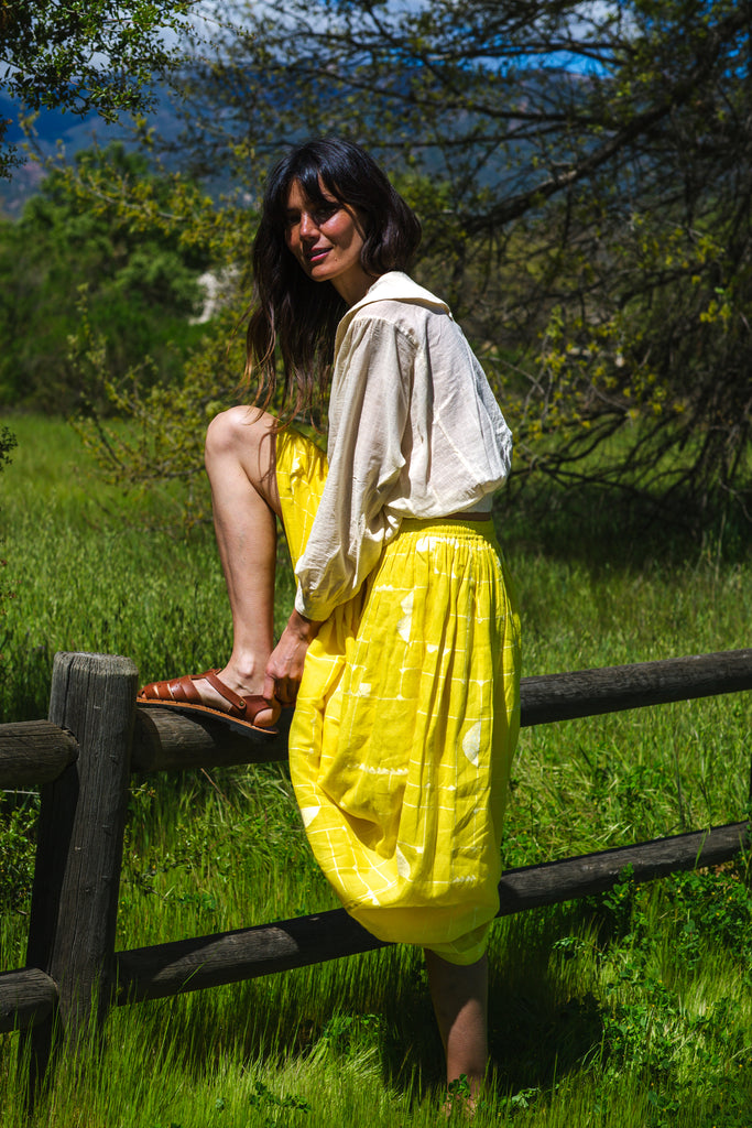 This Lemon Sorbet Skirt is made in collaboration between Erica Kim @ahistoryofarchitecture and World of Crow, it has a yellow color, checks detailing, jamdani fabric, ankle length skirt