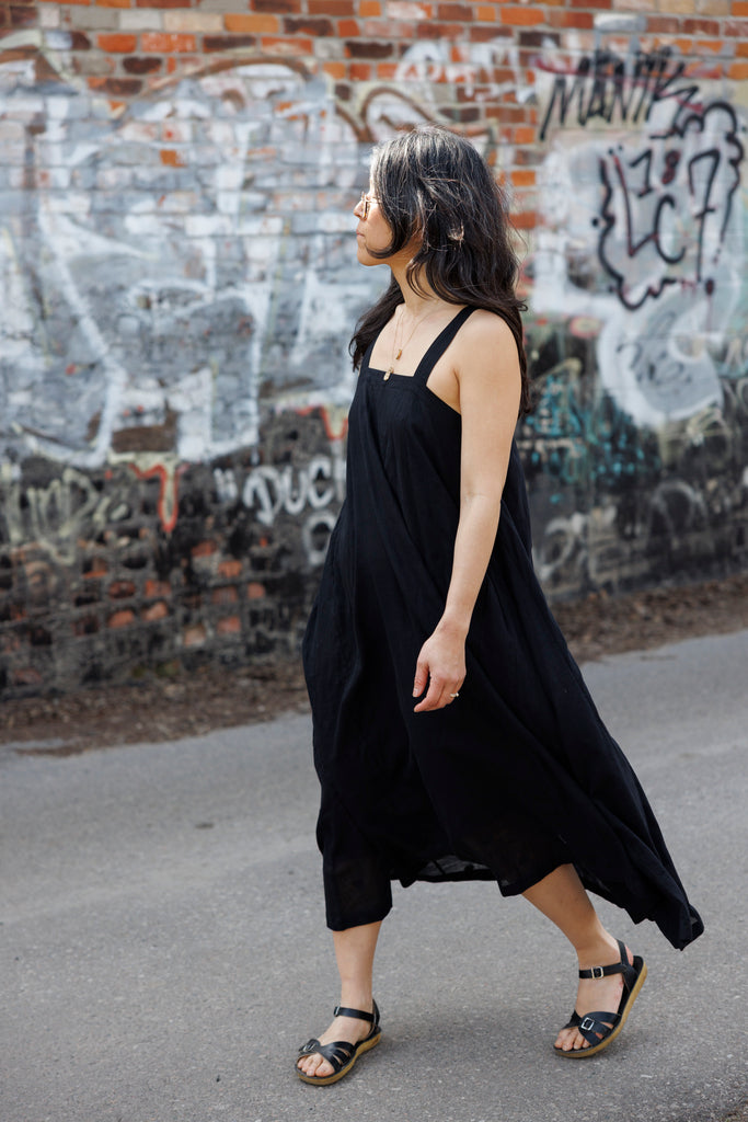 This Everywhere dress is made in collaboration between Erica Kim and World of Crow, it's sleeveless, black in color, Jamdani fabric, Midi length, Sustainably made