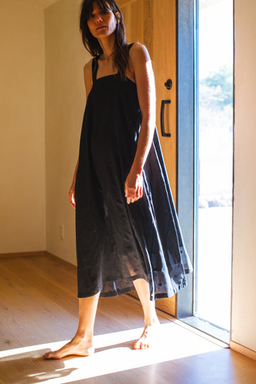 This Everywhere dress is made in collaboration between Erica Kim and World of Crow, it's sleeveless, black in color, Jamdani fabric, Midi length, Sustainably made