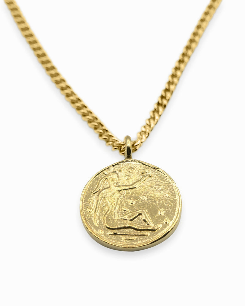 Introducing the Vintage Goddess Coin Necklace, featuring two coins on a 14K gold-plated curb chain. Made from recycled brass, this necklace combines timeless elegance with modern sustainability. Crafted in NYC and LA, it’s a luxurious yet eco-friendly addition to your collection.