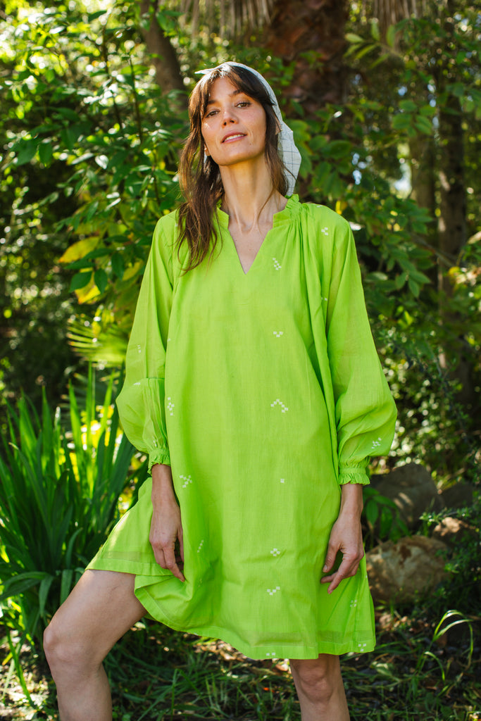 This Pride of Crow mini dress is made in collaboration between Erica Kim and World of Crow, it has a frilled round V-neckline, Sorbet green colour, A-line flare, Drop shoulders, Long gathered cuff sleeves, side pockets, Oversized fit in Jamdani fabric