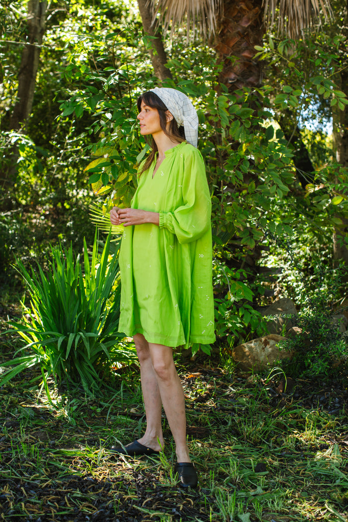 This Pride of Crow mini dress is made in collaboration between Erica Kim and World of Crow, it has a frilled round V-neckline, Sorbet green colour, A-line flare, Drop shoulders, Long gathered cuff sleeves, side pockets, Oversized fit in Jamdani fabric