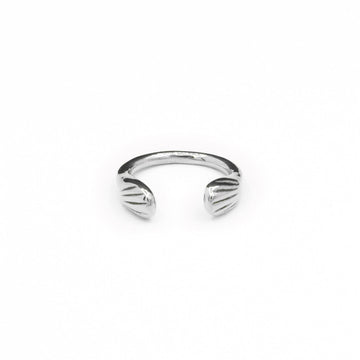 Introducing the sustainably hand-casted silver ring from the Mana Made x CCE Collection, featuring a distinctive wave design inspired by the sea. Crafted from recycled sterling silver and brass, this adjustable ring fits sizes 6 to 9, embodying a commitment to both style and environmental responsibility.