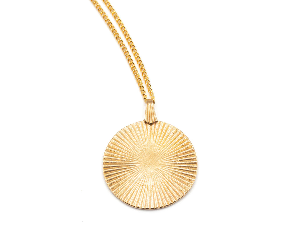 Introducing the Vintage-Inspired Gold Sunburst Pendant Necklace. This elegant gold disc features a sunburst design, gracefully suspended from a 21" chain. Choose between a 14K Gold Plated Curb Chain or a 14K Gold Filled Link Chain for a touch of customizable sophistication.