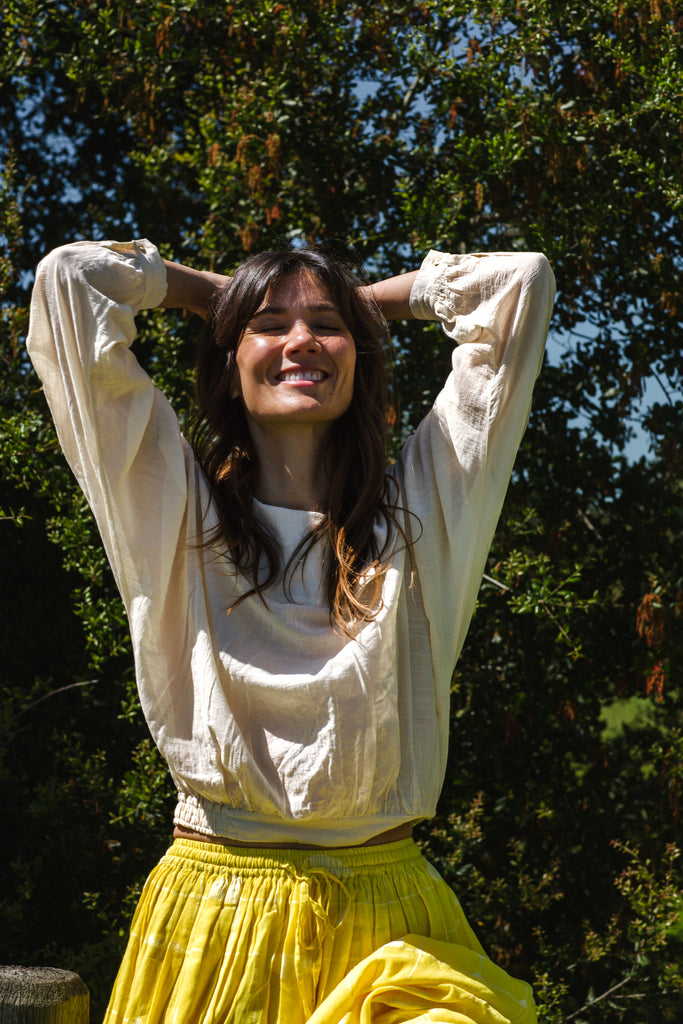 Introducing the Vintage Bertha Blouse, a timeless summer staple exuding effortless charm. Crafted from handwoven cotton in a serene off-white hue, it offers versatility and breathability for warmer days. Boasting a classic bertha collar, three-quarter sleeves, and a straight hem, this blouse epitomizes understated elegance. Pair it with any bottom for a stylish ensemble suitable for any occasion.