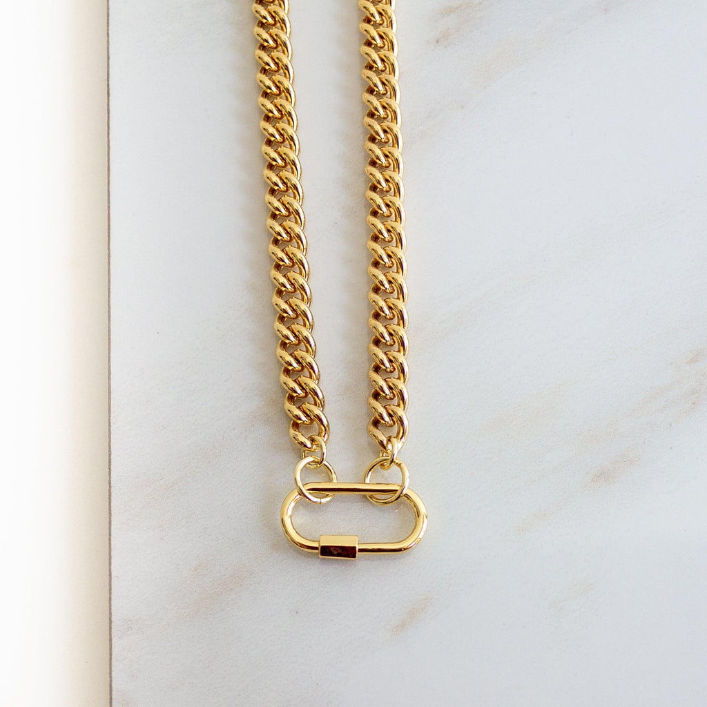 Introducing our bold and versatile gold-plated brass chain bracelet, featuring a chic carabiner closure for a touch of modern elegance. This bracelet boasts a 17" chain with an additional 1.5" carabiner, totaling 18.5" in length. Expertly crafted, it combines style and functionality, adding a sophisticated edge to any outfit