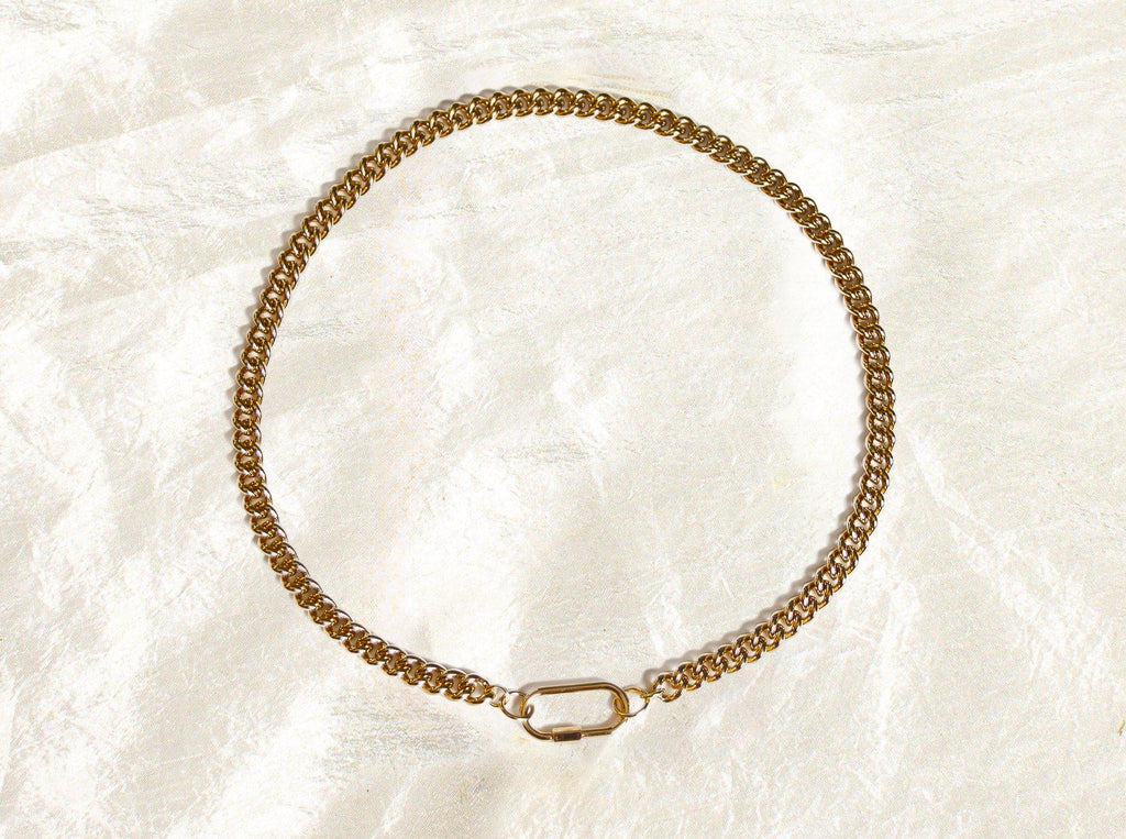 Introducing our bold and versatile gold-plated brass chain bracelet, featuring a chic carabiner closure for a touch of modern elegance. This bracelet boasts a 17" chain with an additional 1.5" carabiner, totaling 18.5" in length. Expertly crafted, it combines style and functionality, adding a sophisticated edge to any outfit