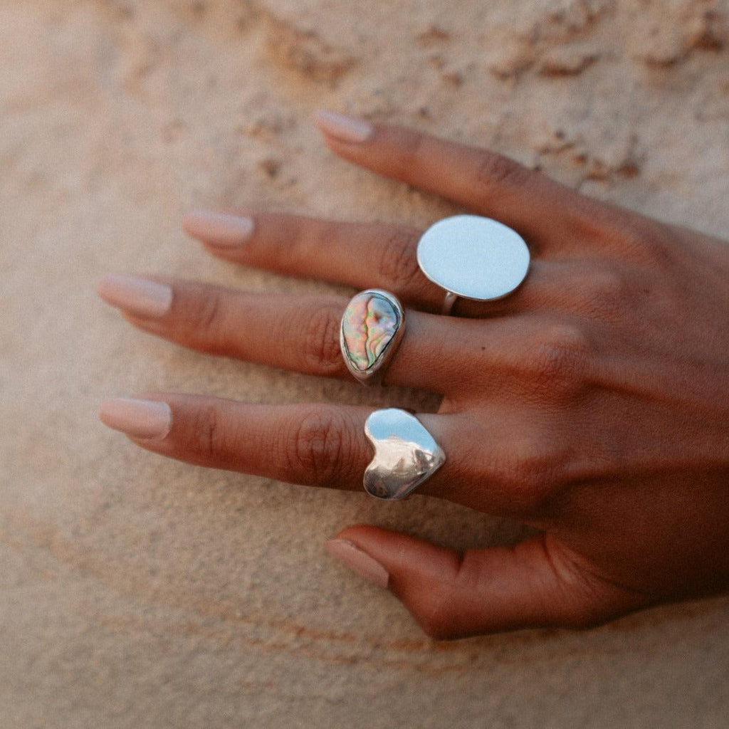 Introducing the Eros Heart Ring, a luxurious signet style crafted from an original wax sculpture and cast in recycled sterling silver. Named after the Greek god of love, this chunky ring is available in brass, gold plated, and 14k gold. Each piece is made to order with meticulous care, perfect for elevating any occasion.