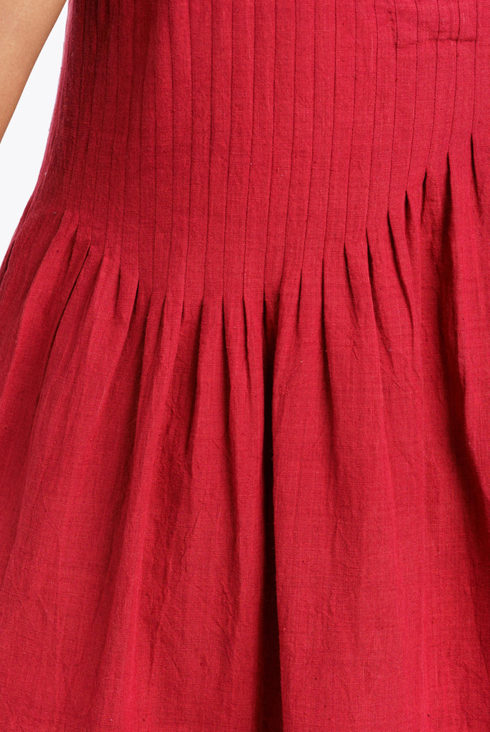 Red pleated midi dress, best ethical clothing brands India, best sustainable clothing brands, organic cotton wear, organic dresses online, cotton only clothing, cotton only clothing store, women's organic dresses, lightweight cotton women's clothing, clothing brands for minimalists, design minimalist wardrobe