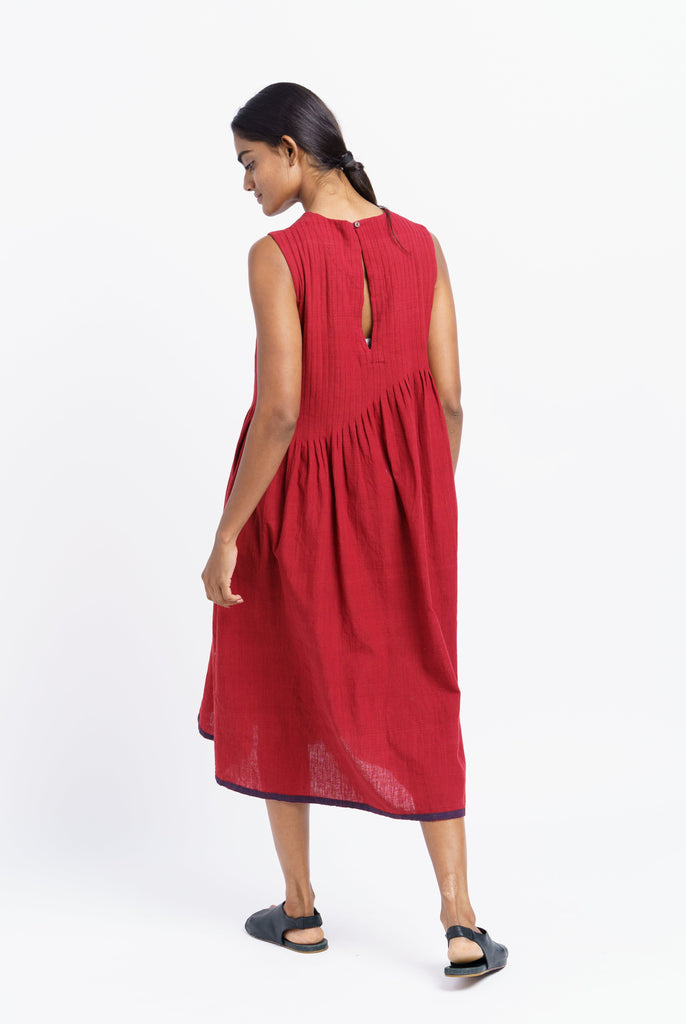 Red pleated midi dress, best ethical clothing brands India, best sustainable clothing brands, organic cotton wear, organic dresses online, cotton only clothing, cotton only clothing store, women's organic dresses, lightweight cotton women's clothing, clothing brands for minimalists, design minimalist wardrobe